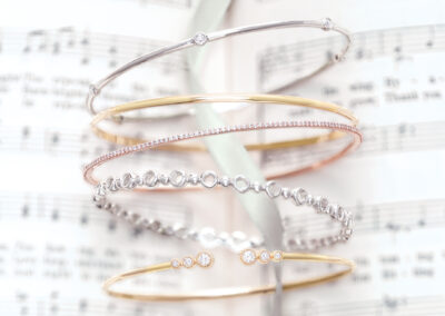 Gold, silver, and rose gold bangle bracelets - Something Beautiful Fine Jewelry